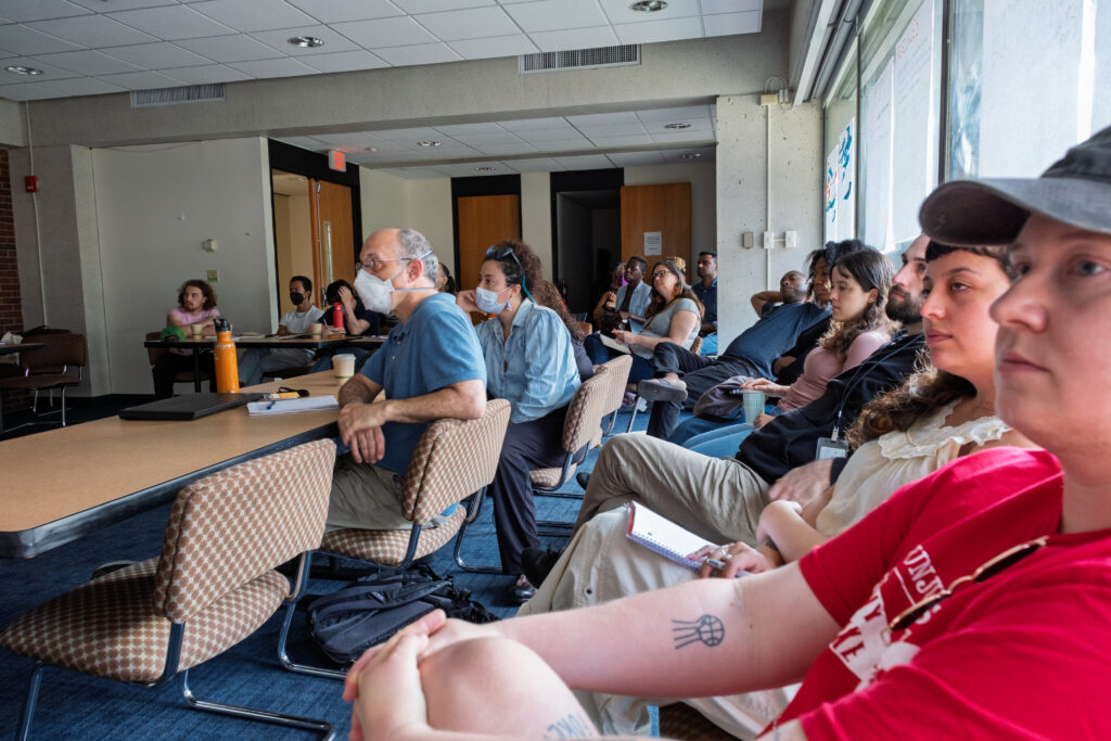 Summer Institute participants listening to a brief lecture in a classroom